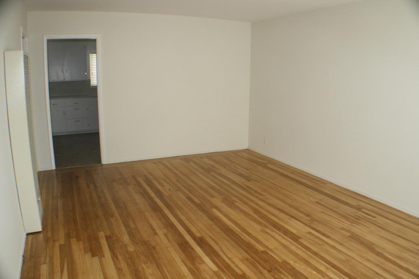 1927 Palm Avenue San Mateo, CA 94403 - Photo 13 of 19 a view of empty room with wooden floor