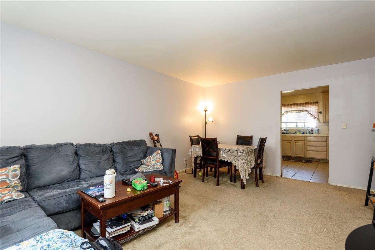 1927 Palm Avenue San Mateo, CA 94403 - Photo 3 of 19 a living room with furniture and a dining table