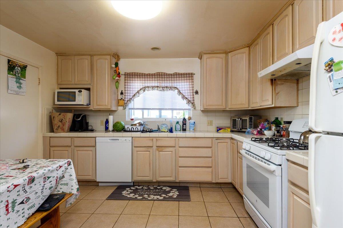 1927 Palm Avenue San Mateo, CA 94403 - Photo 6 of 19 a kitchen with a cabinets and appliances