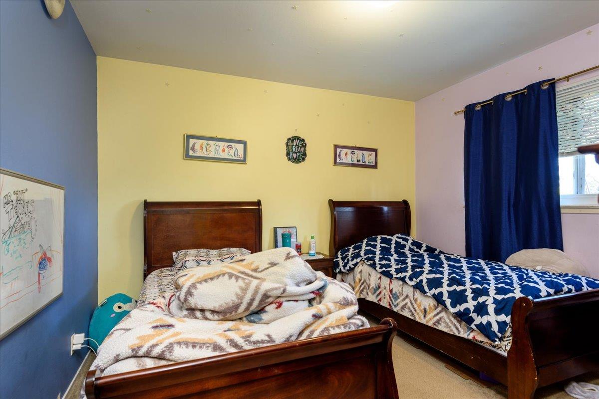 1927 Palm Avenue San Mateo, CA 94403 - Photo 9 of 19 a bedroom with bed and wooden floor