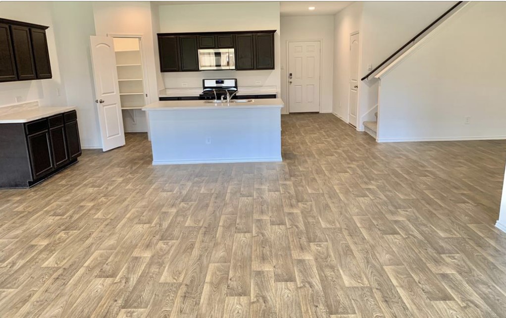 21310 Riverdew Drive Katy, TX 77449 - Photo 2 of 12 a view of a kitchen with microwave and cabinets
