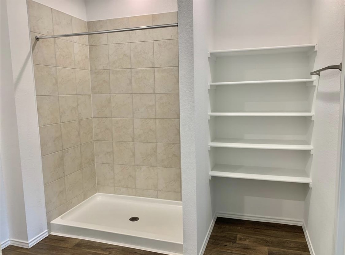 21310 Riverdew Drive Katy, TX 77449 - Photo 5 of 12 a bathroom with a bath tub