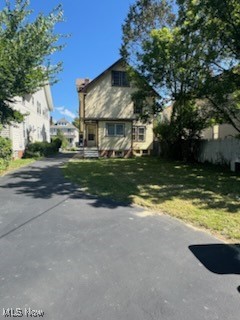 870 Helmsdale Road Cleveland Heights, OH 44112 - Photo 19 of 20 Rear view of property with a yard