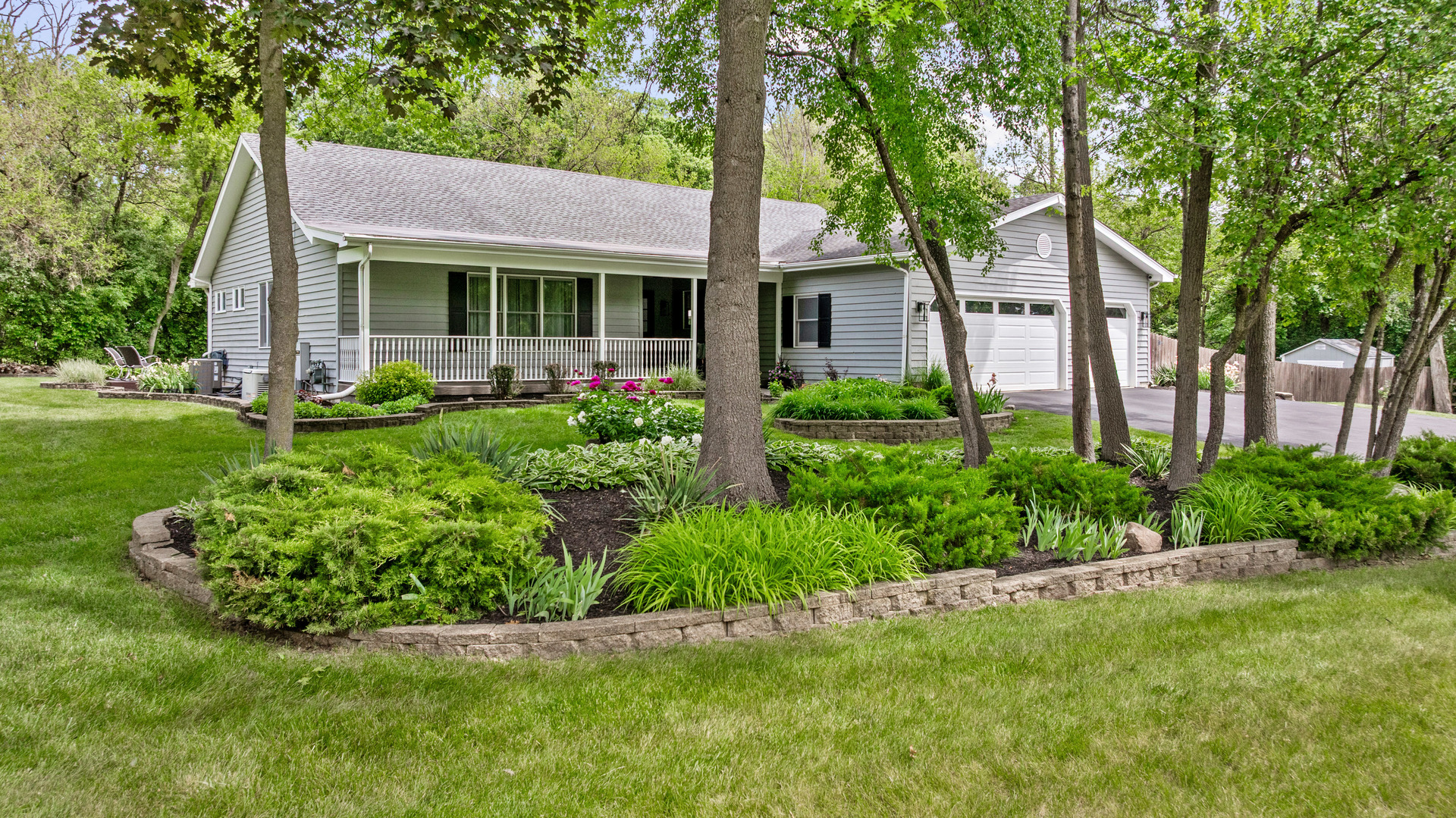 28W140 Mack Road Wheaton, IL 60189 - Photo 1 of 48 a front view of a house with a yard and porch