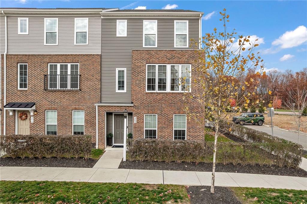 a front view of a house with a yard