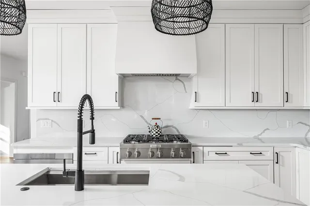 a kitchen with stainless steel appliances kitchen island a cabinets and a counter top space