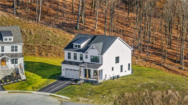 front view of a house with a yard