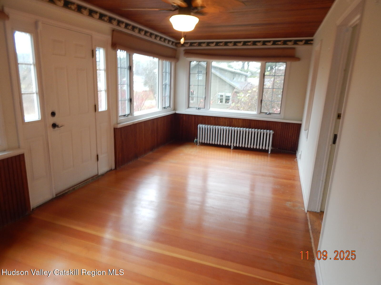 118 Ingalside Road Greenville, NY 12083 - Photo 17 of 37 a view of an empty room with wooden floor and a window
