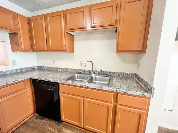 a white refrigerator freezer and a stove sitting inside of a kitchen