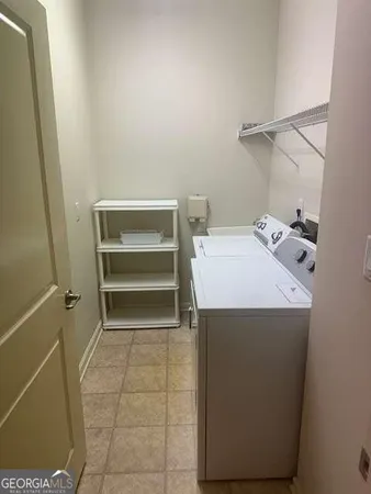 a utility room with washer and dryer