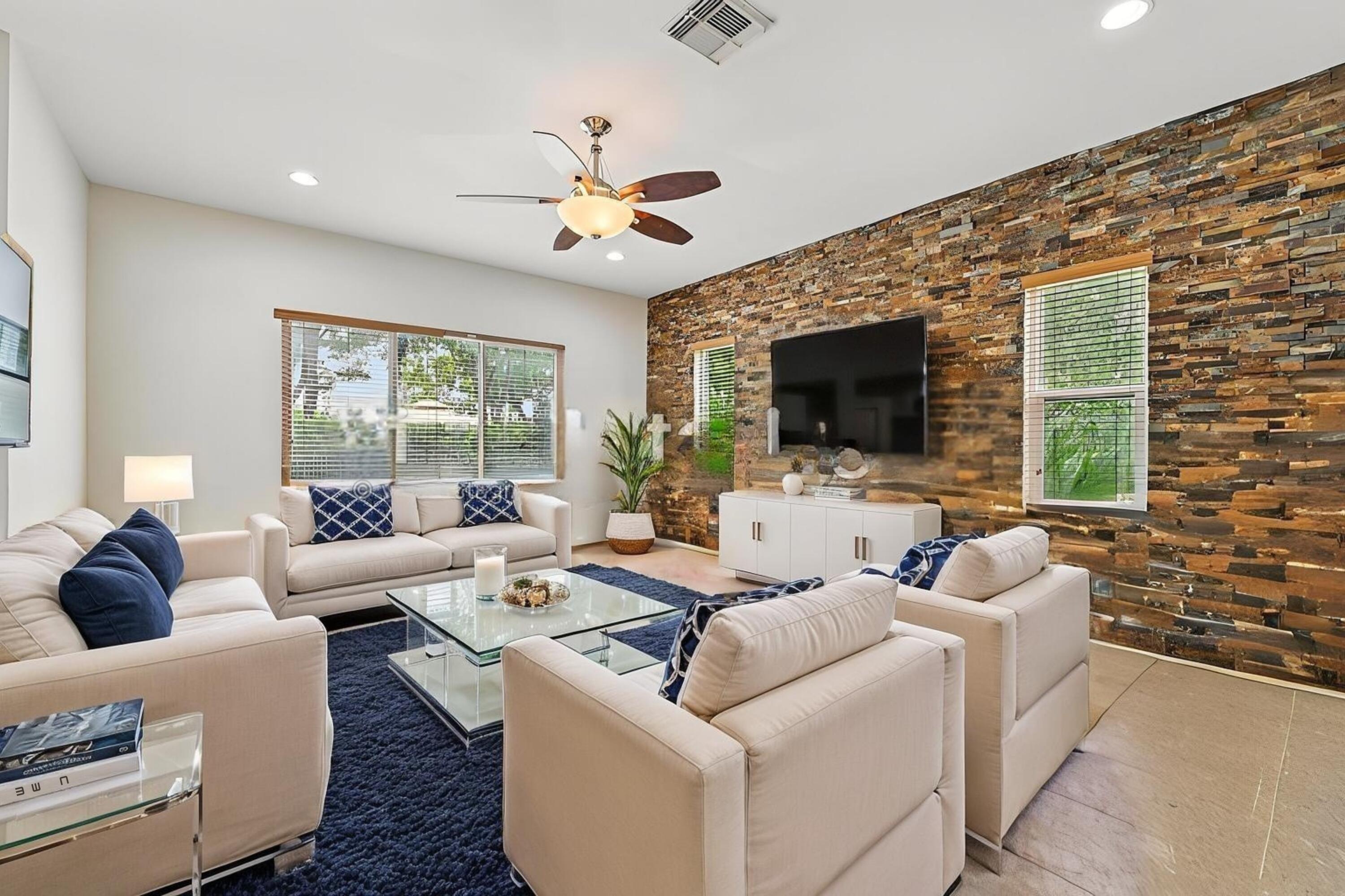 a living room with furniture fireplace and a flat screen tv