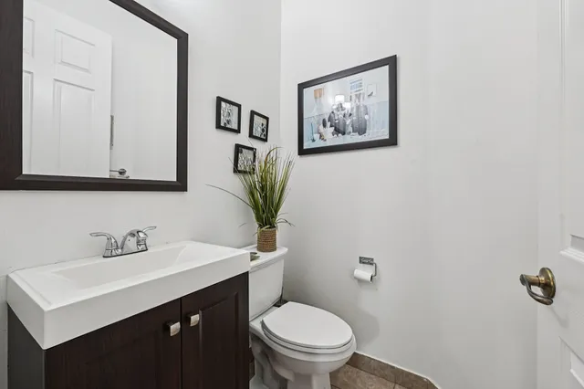 a bedroom with a bed and a dresser in it