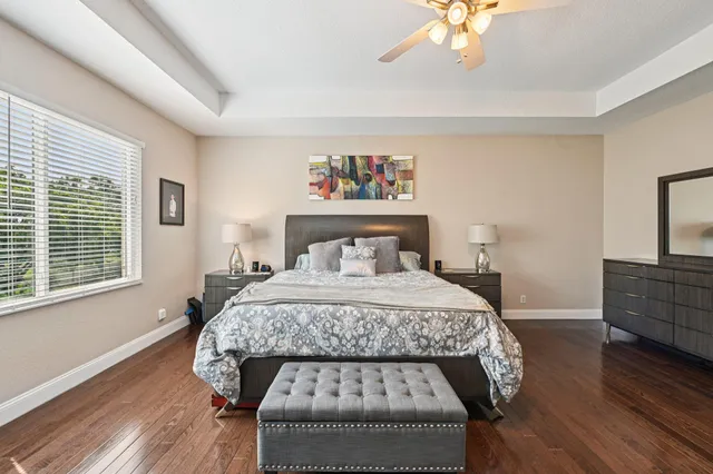 a front view of a house with a garden and plants