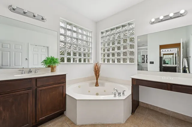 a front view of house with yard swimming pool and patio