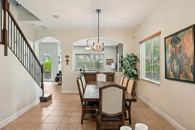 a kitchen with stainless steel appliances granite countertop a refrigerator stove microwave and sink