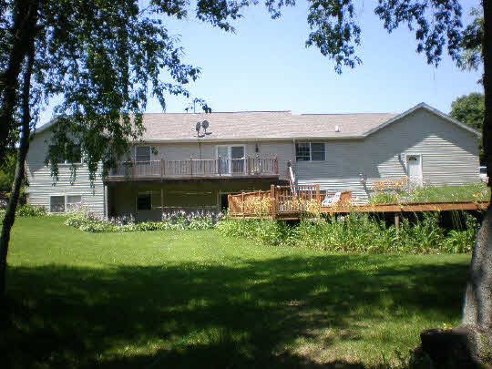 4177 North Meridian Road Rockford, IL 61101 - Photo 2 of 11 a front view of a house with a garden