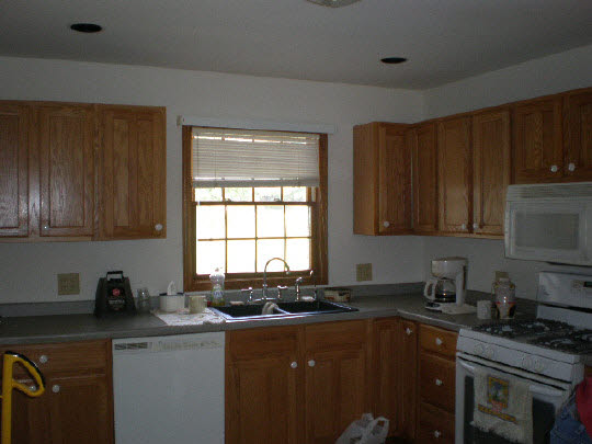 4177 North Meridian Road Rockford, IL 61101 - Photo 9 of 11 a kitchen with granite countertop a sink cabinets and window