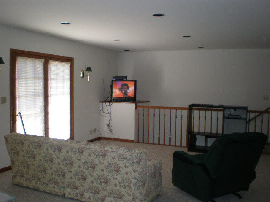 4177 North Meridian Road Rockford, IL 61101 - Photo 10 of 11 a living room with furniture and a flat screen tv