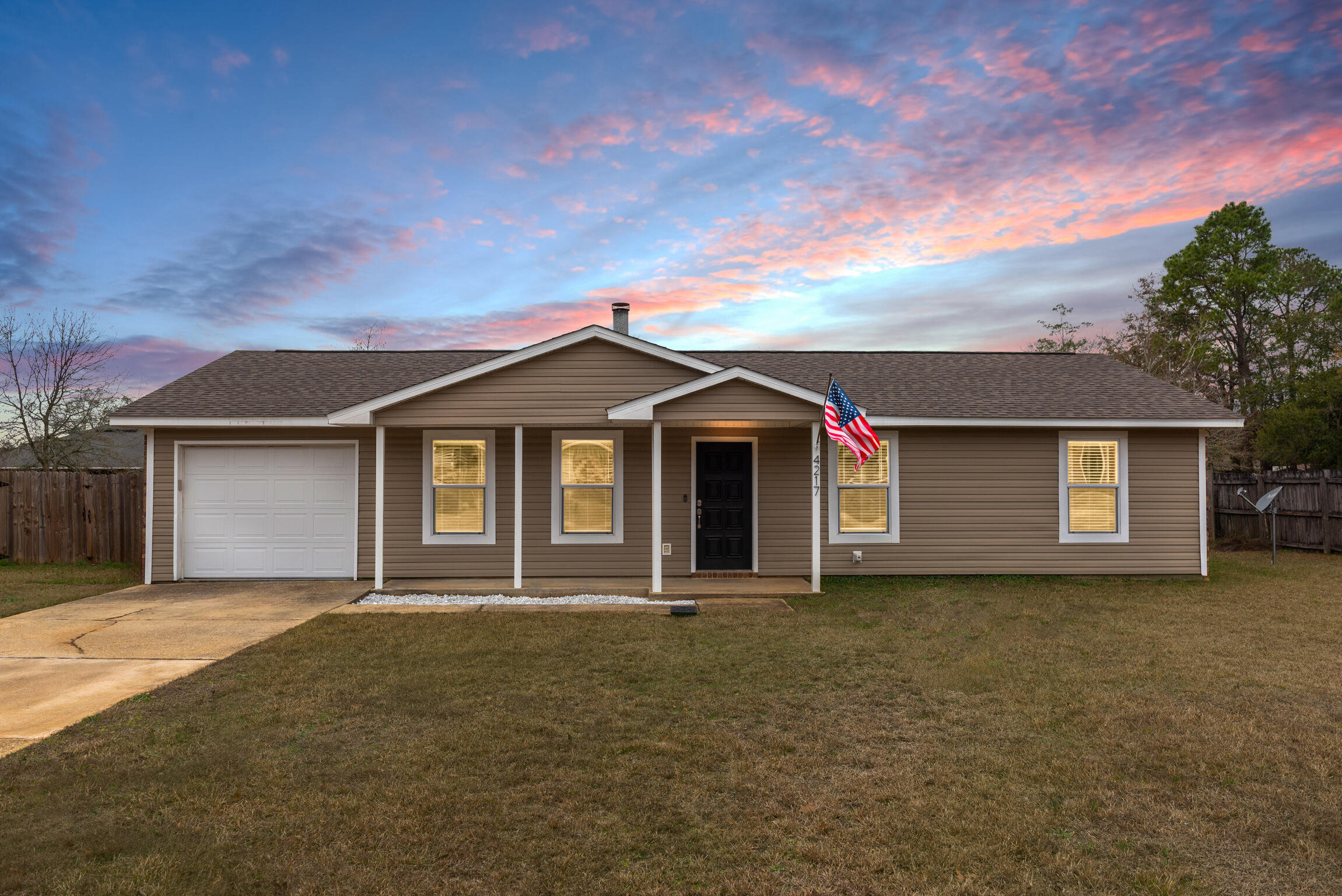 4217 North Island Road Pace, FL 32571 - Photo 1 of 25 a front view of a house with a yard
