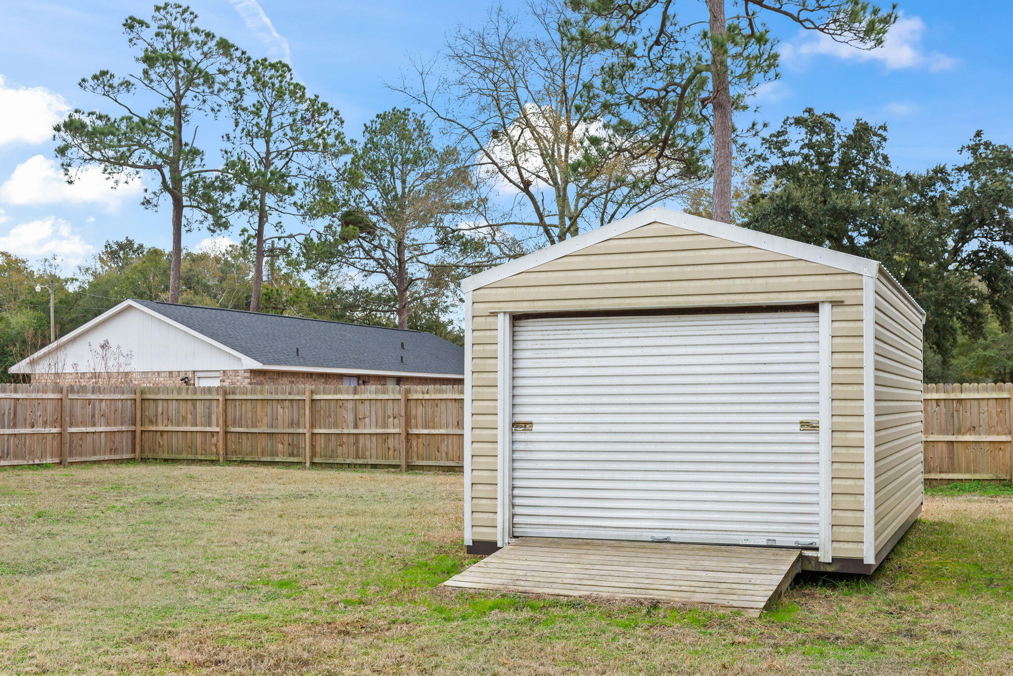 4217 North Island Road Pace, FL 32571 - Photo 21 of 25 a front view of a house with a garden