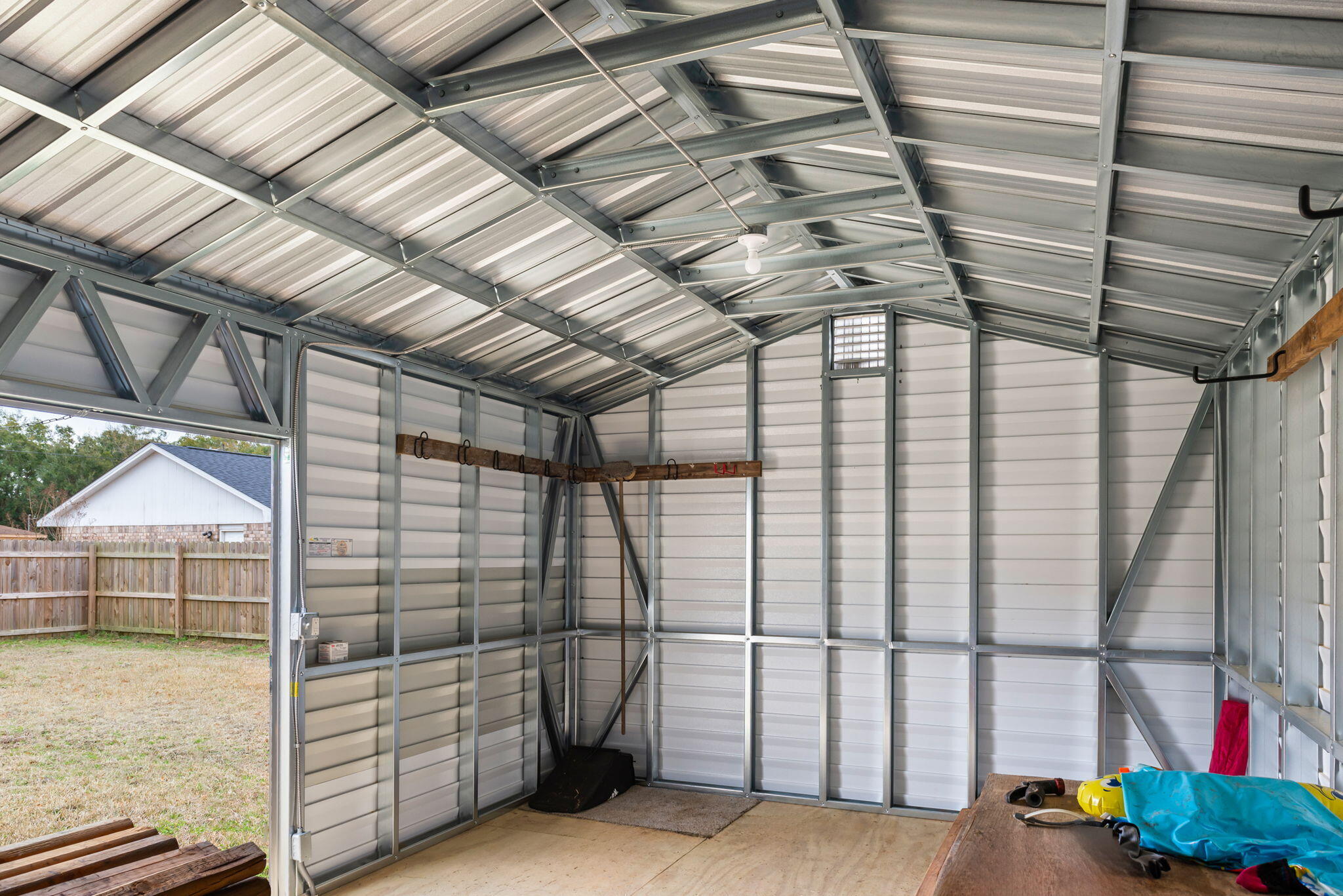 4217 North Island Road Pace, FL 32571 - Photo 23 of 25 a view of a room with racks