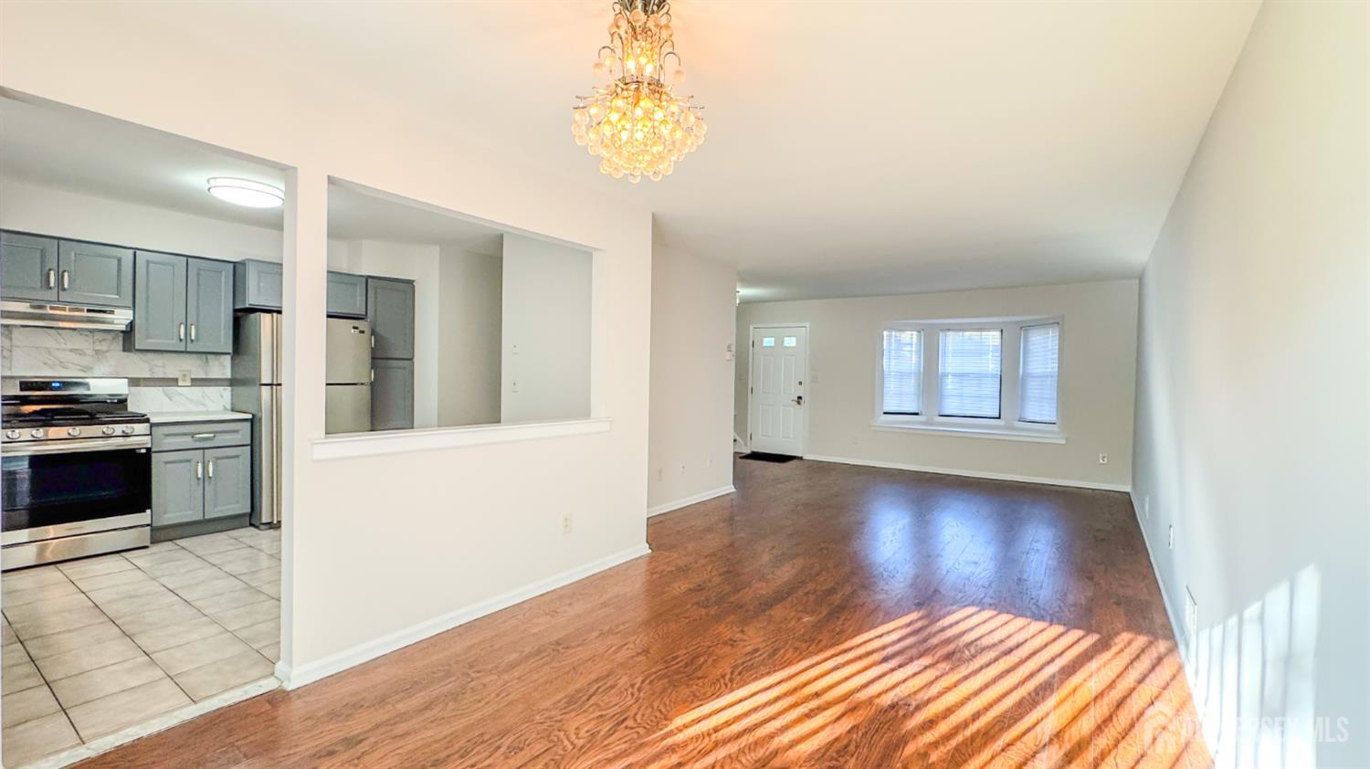 1204 Maplecrest Road Edison, NJ 08820 - Photo 8 of 17 a view of a kitchen with wooden floor and a kitchen