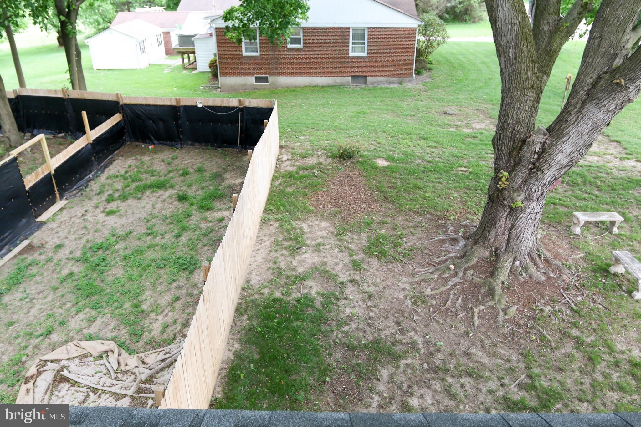 3309 Offutt Road Randallstown, MD 21133 - Photo 20 of 21 Side Yard with view of sitting area and swing
