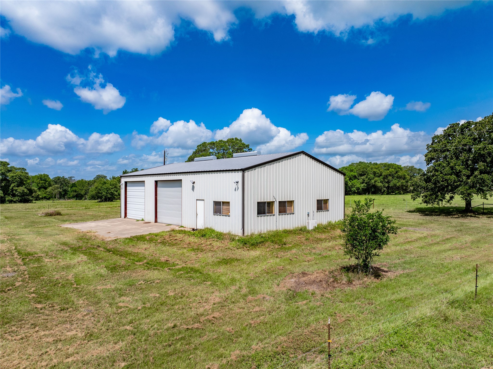 1470 South Nassau Road Round Top, TX 78954 - Photo 21 of 30 a view of a house with a yard