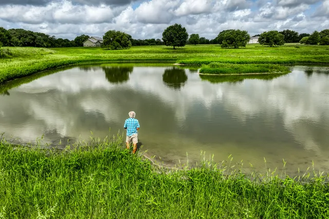 a view of a lake with a house in the background