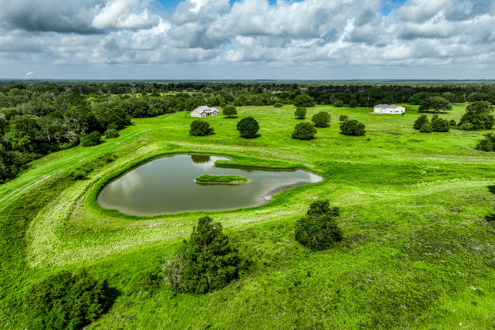1470 South Nassau Road Round Top, TX 78954 - Photo 6 of 30 a view of a lush green field