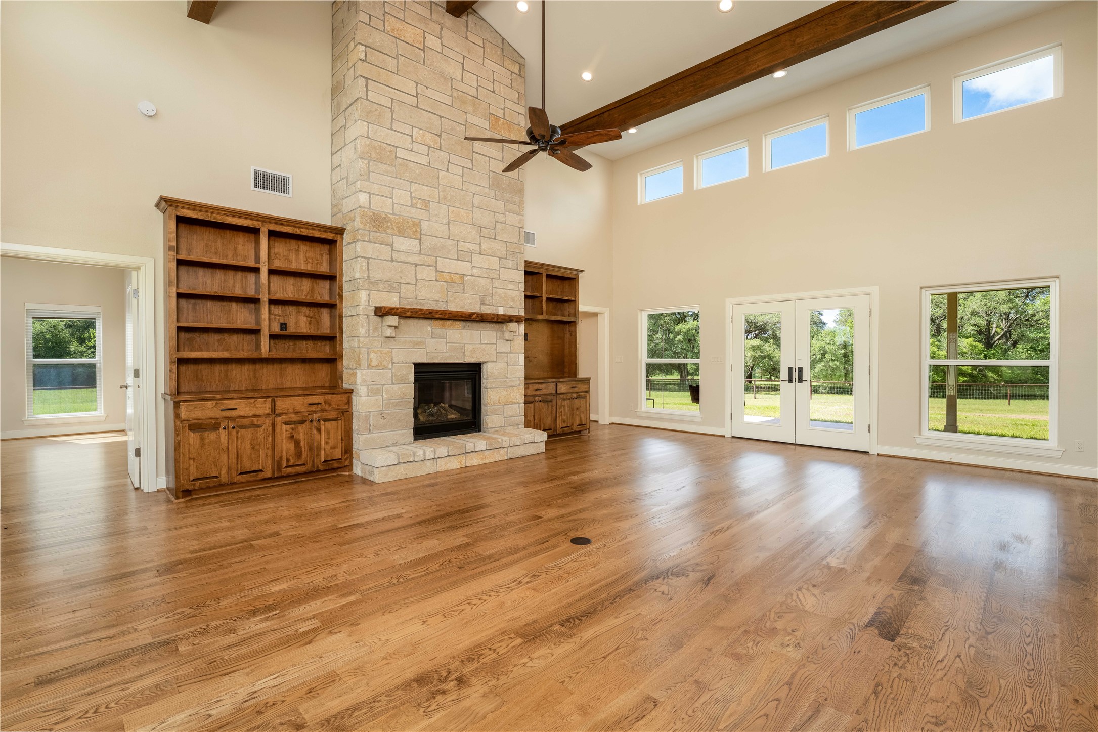 1470 South Nassau Road Round Top, TX 78954 - Photo 10 of 30 a view of an empty room with a fireplace and a window