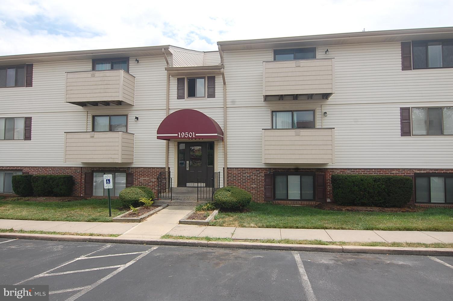 19501 Gunners Branch Road, Unit M Germantown, MD 20876 - Photo 1 of 11 a front view of a house with a yard
