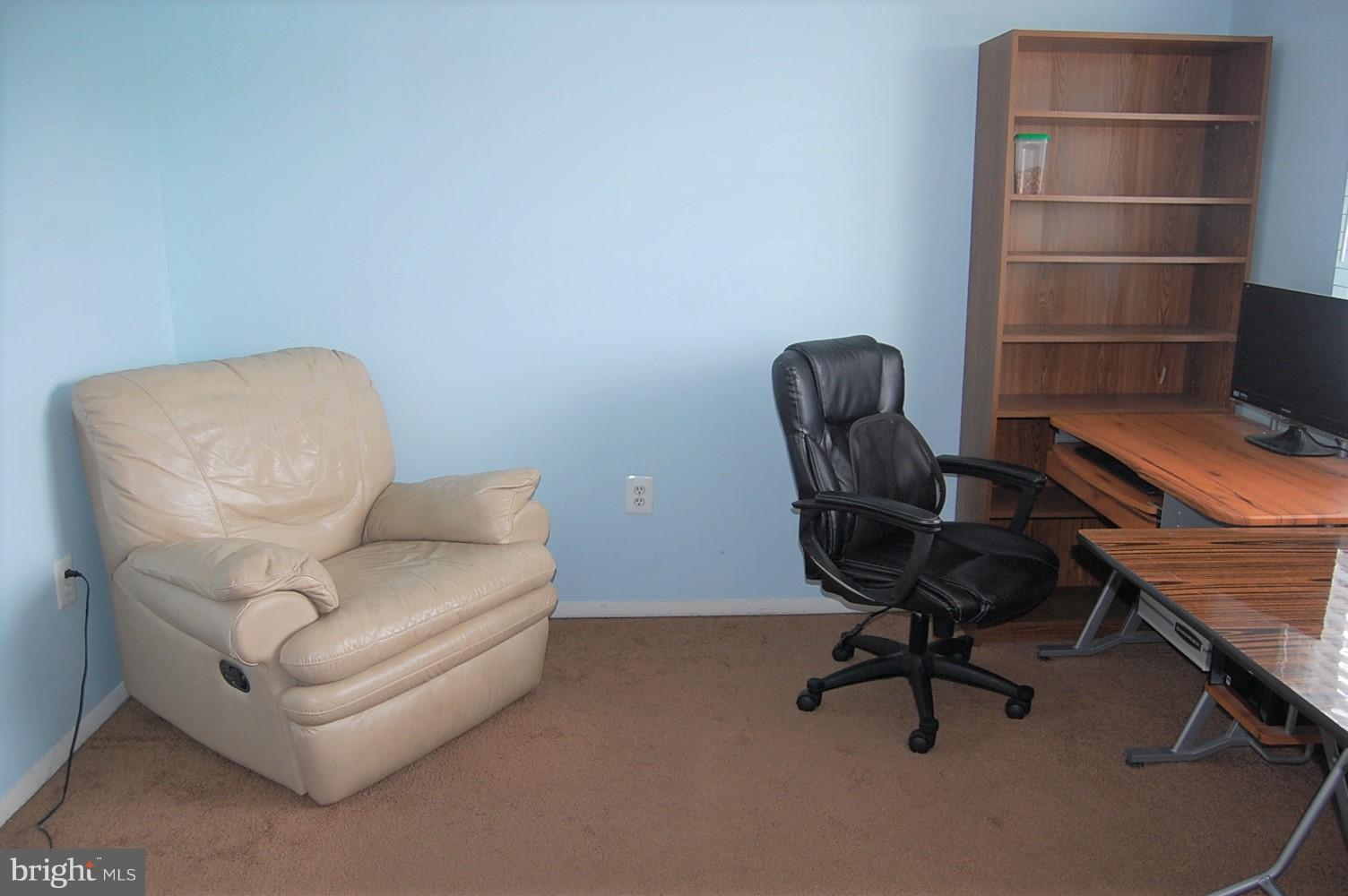19501 Gunners Branch Road, Unit M Germantown, MD 20876 - Photo 11 of 11 a work room with furniture and a chair