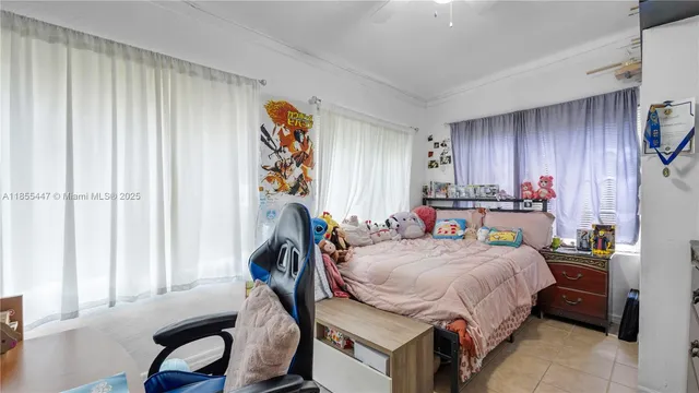 a bed room with a bed and a window