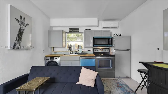 a kitchen with sink cabinets and stainless steel appliances