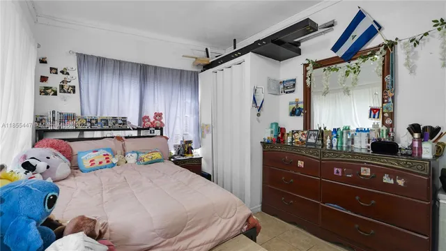 a bed room with a bed and a dresser