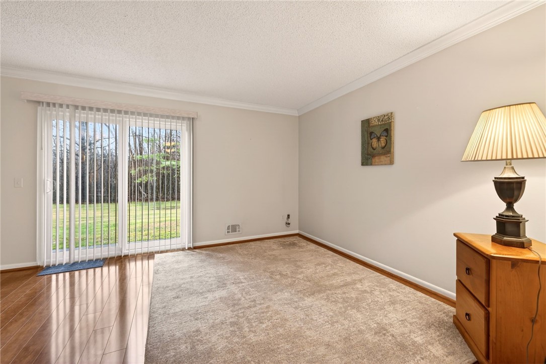 609 French Road Brighton, NY 14618 - Photo 14 of 30 Sliding glass door leads to patio with view of the