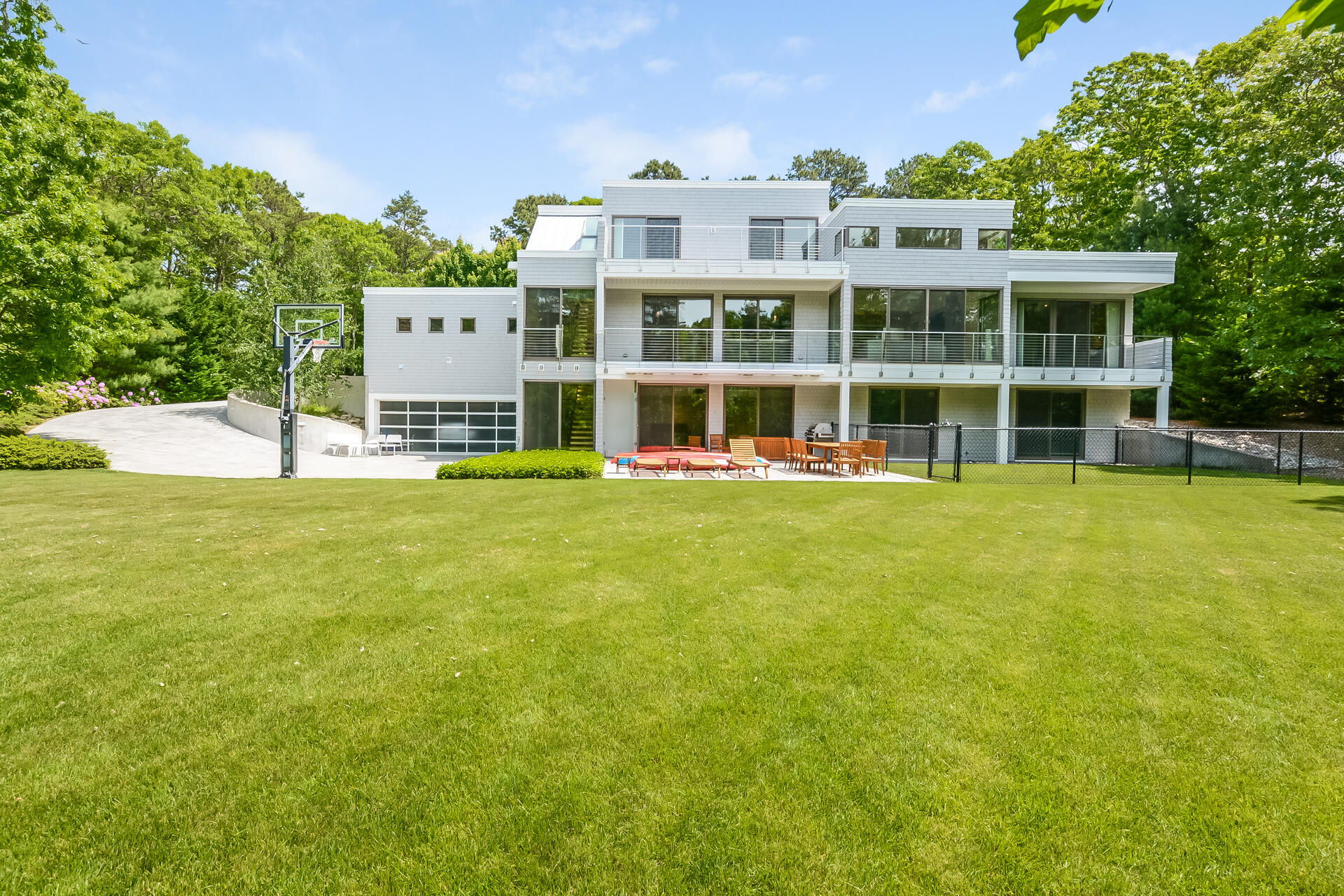 37 The Hunt Circle Mashpee, MA 02649 - Photo 1 of 73 a view of a large building with a big yard and large trees