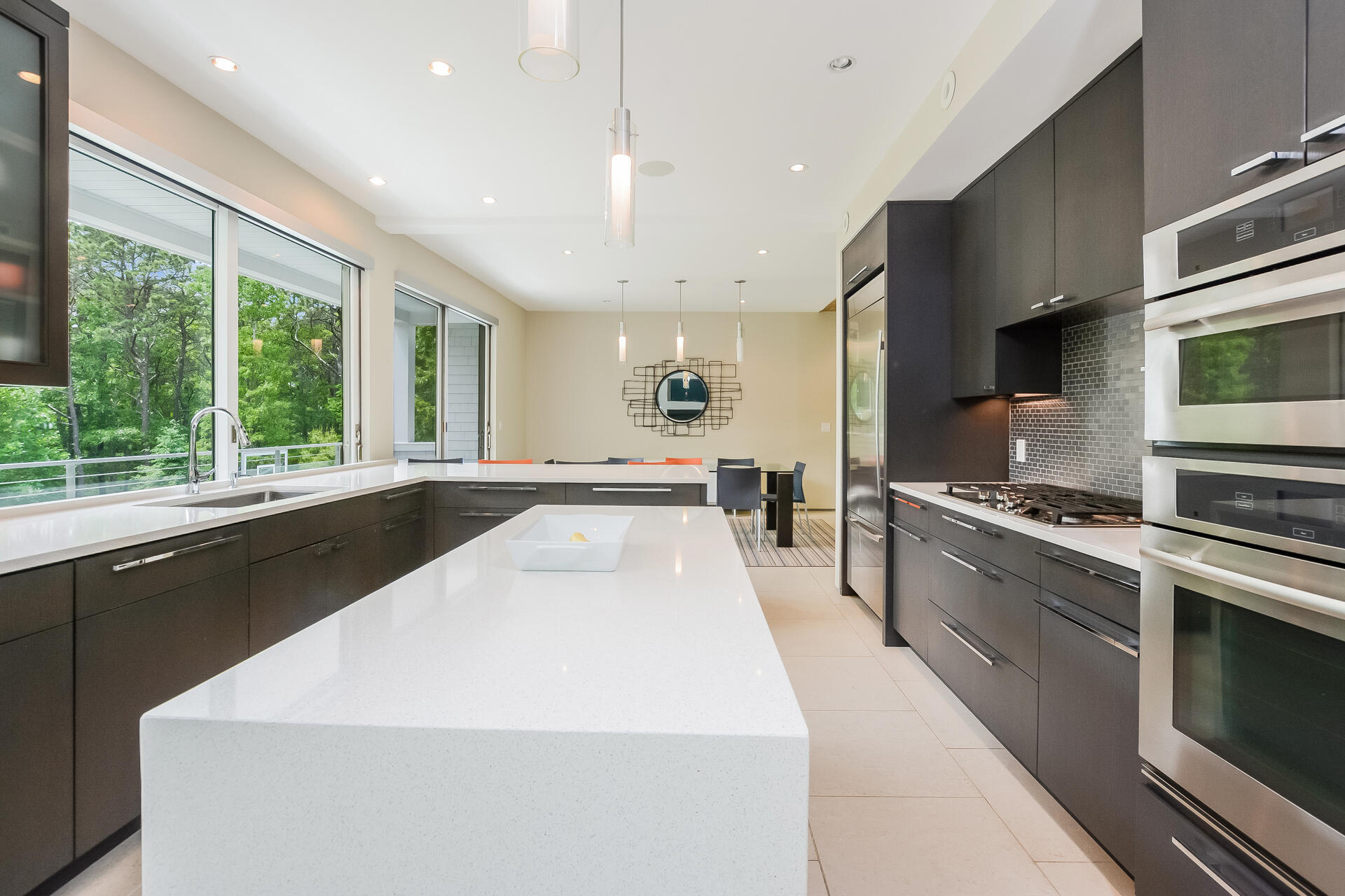 37 The Hunt Circle Mashpee, MA 02649 - Photo 14 of 73 a large kitchen with stainless steel appliances a large counter top a stove a sink and a refrigerator