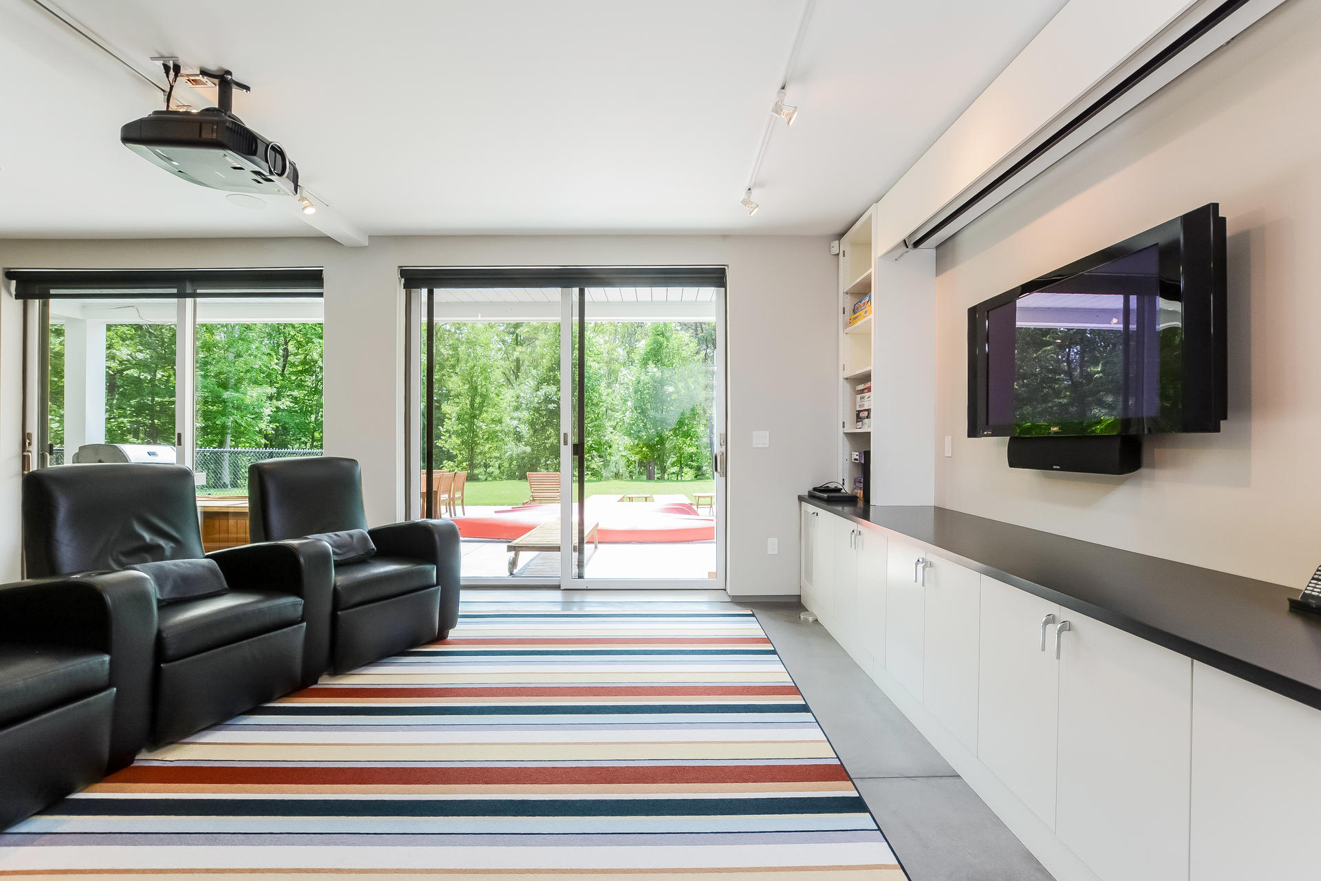 37 The Hunt Circle Mashpee, MA 02649 - Photo 45 of 73 a spacious bedroom with a large bed and a flat tv screen