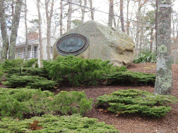 37 The Hunt Circle Mashpee, MA 02649 - Photo 66 of 73 a view of a backyard with plants and a large tree