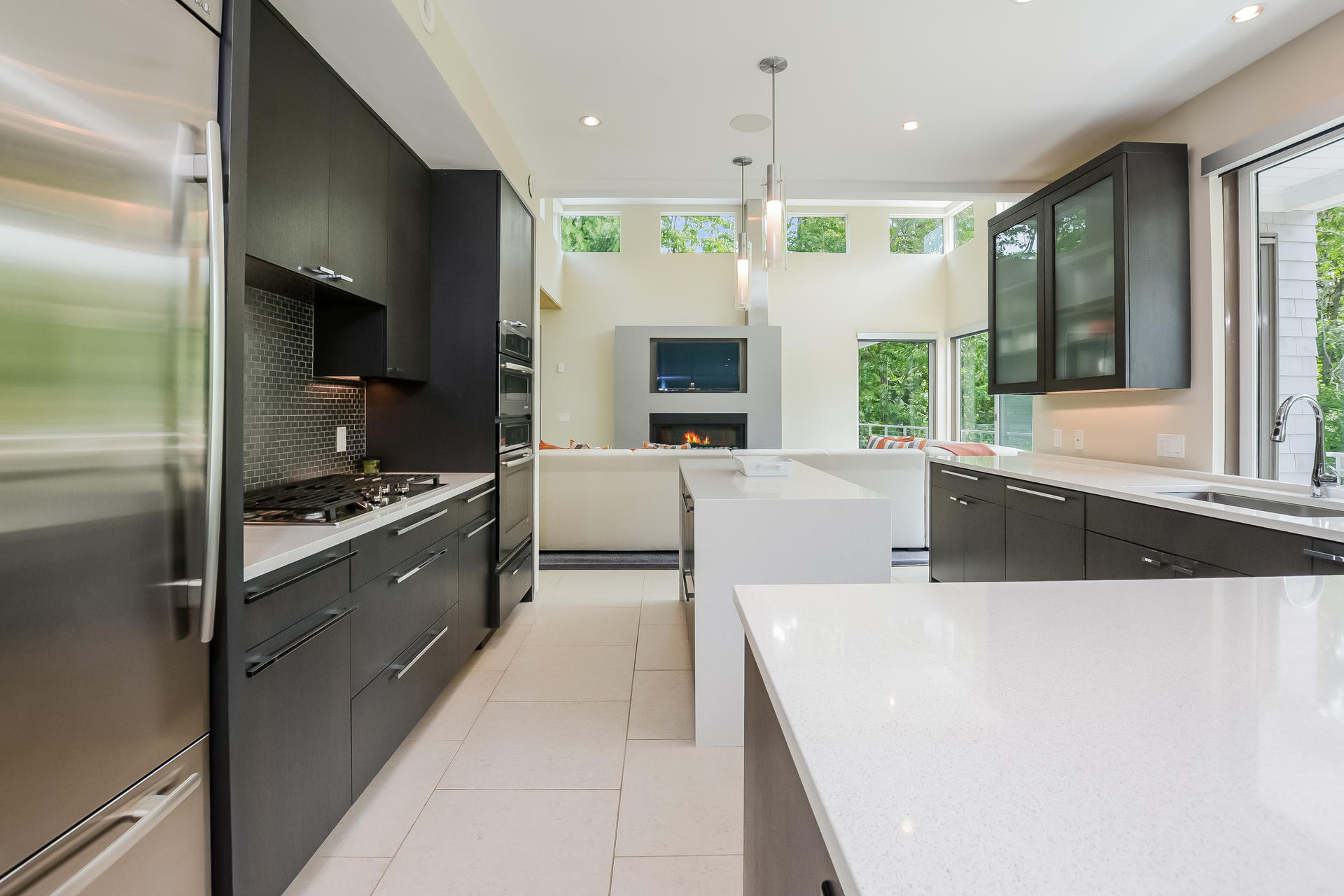 37 The Hunt Circle Mashpee, MA 02649 - Photo 10 of 73 a large kitchen with stainless steel appliances a large counter top a stove a refrigerator and a large window