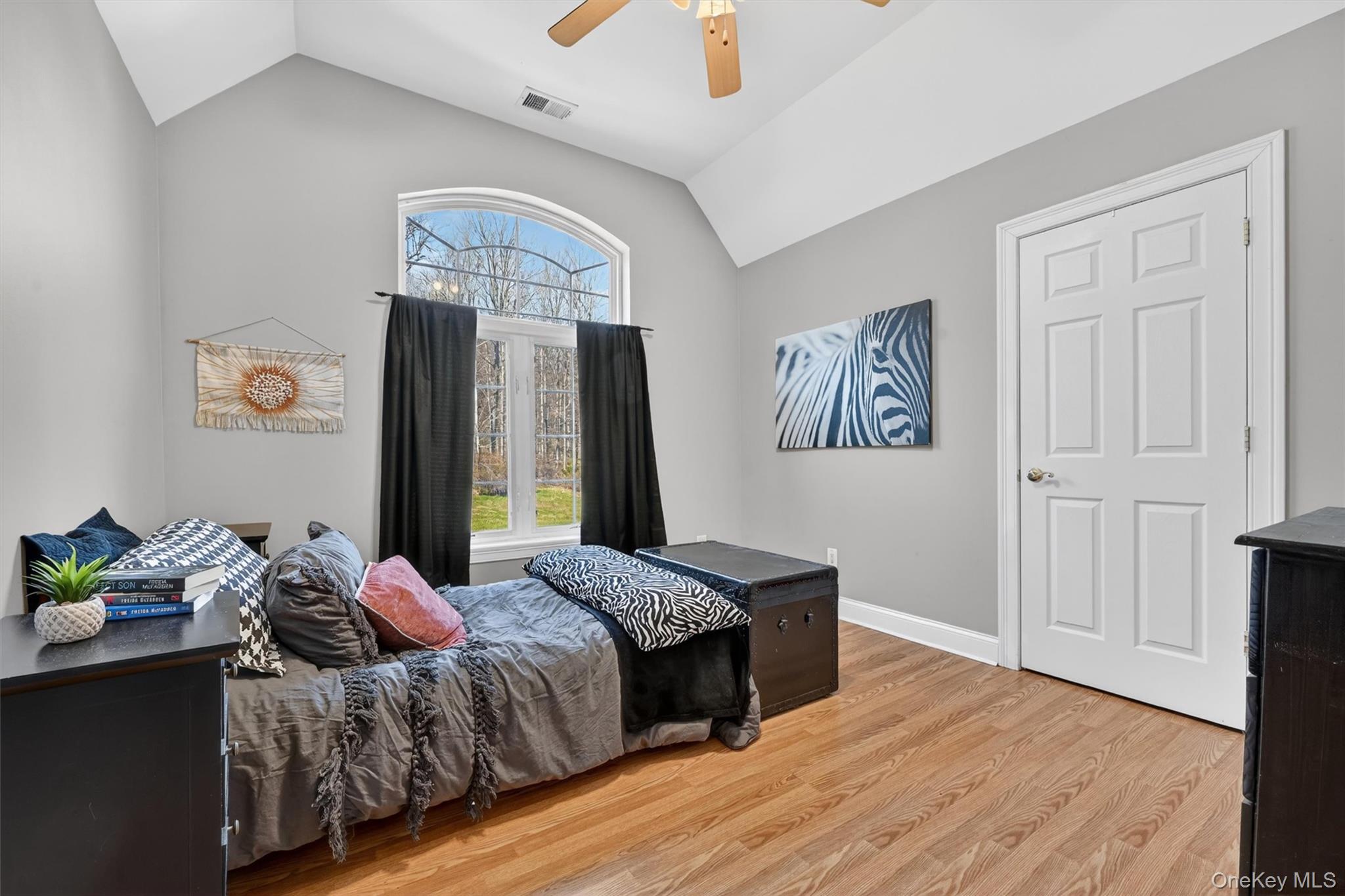 47 Willets Way Newburgh, NY 12550 - Photo 24 of 50 a bedroom with a bed and a chandelier