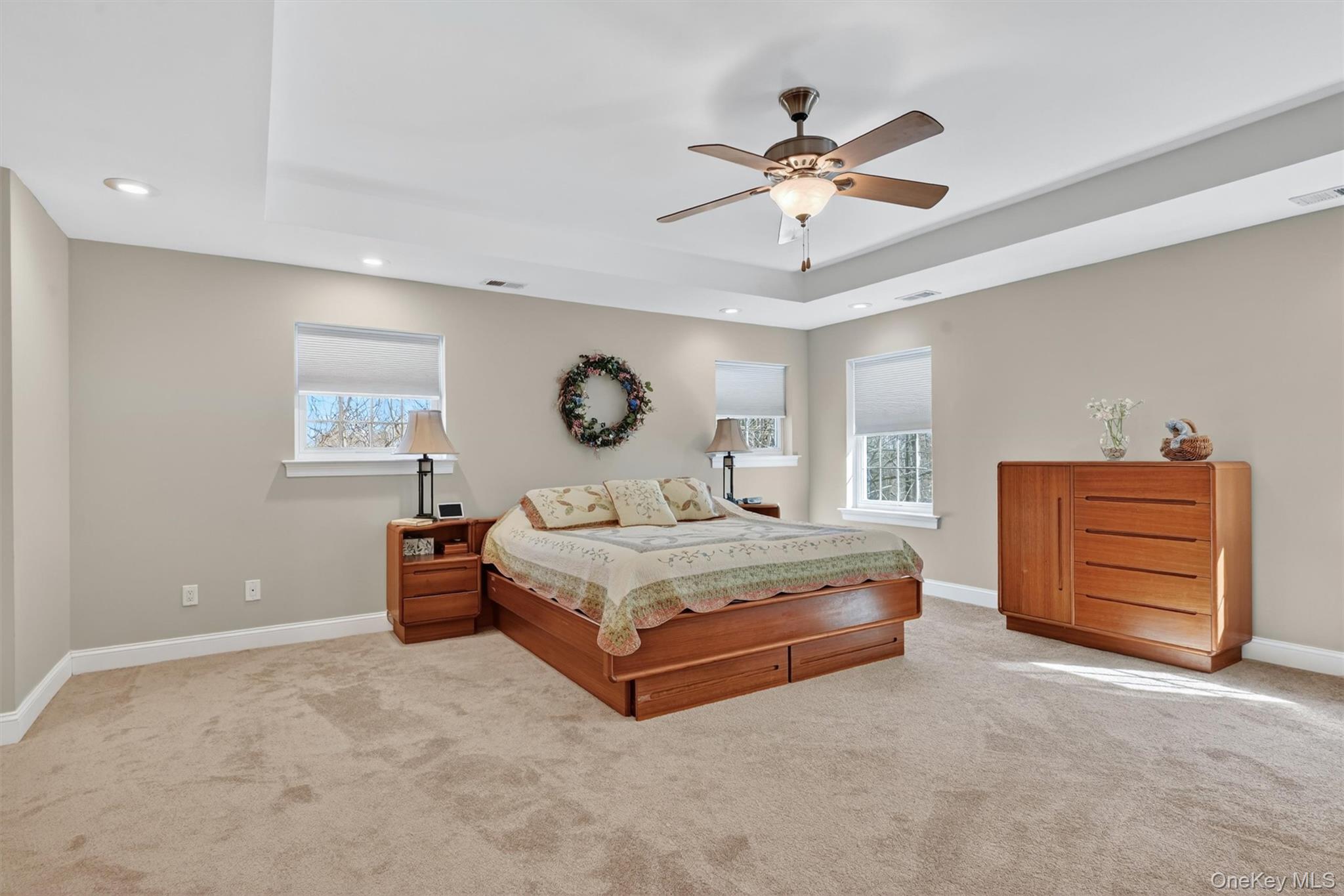 47 Willets Way Newburgh, NY 12550 - Photo 30 of 50 a spacious bedroom with a bed and a chandelier