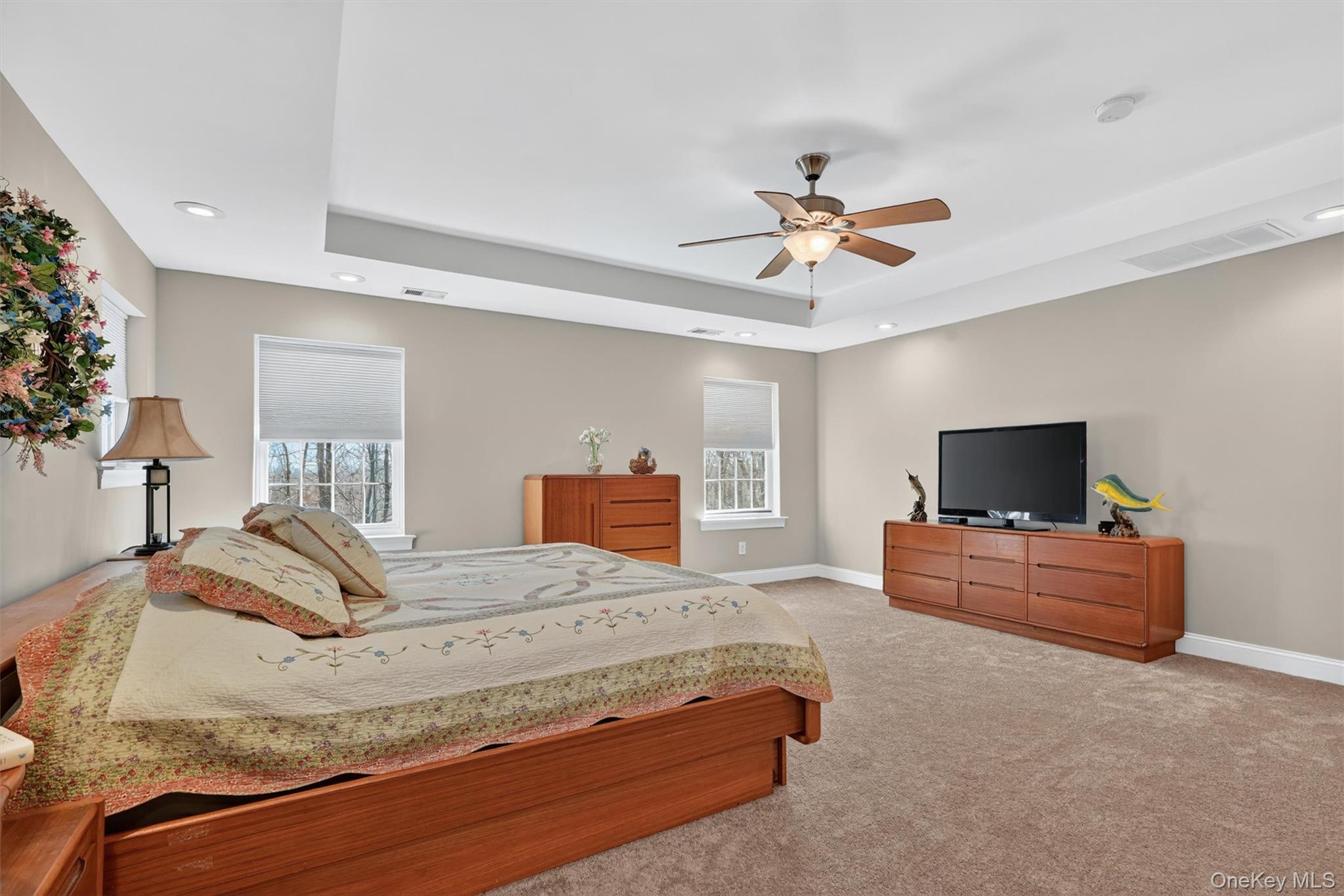 47 Willets Way Newburgh, NY 12550 - Photo 31 of 50 a bedroom with a bed and a chandelier