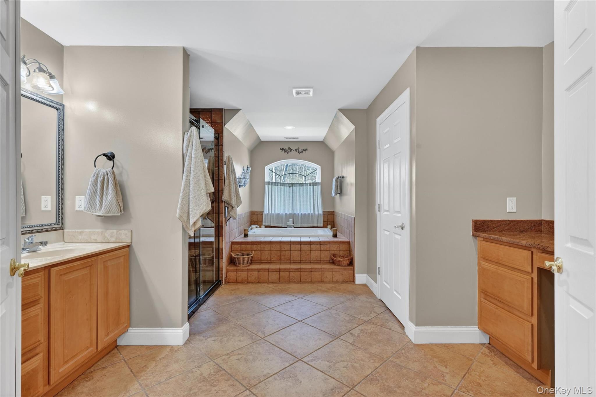 47 Willets Way Newburgh, NY 12550 - Photo 34 of 50 a spacious bathroom with a sink a mirror and a shower