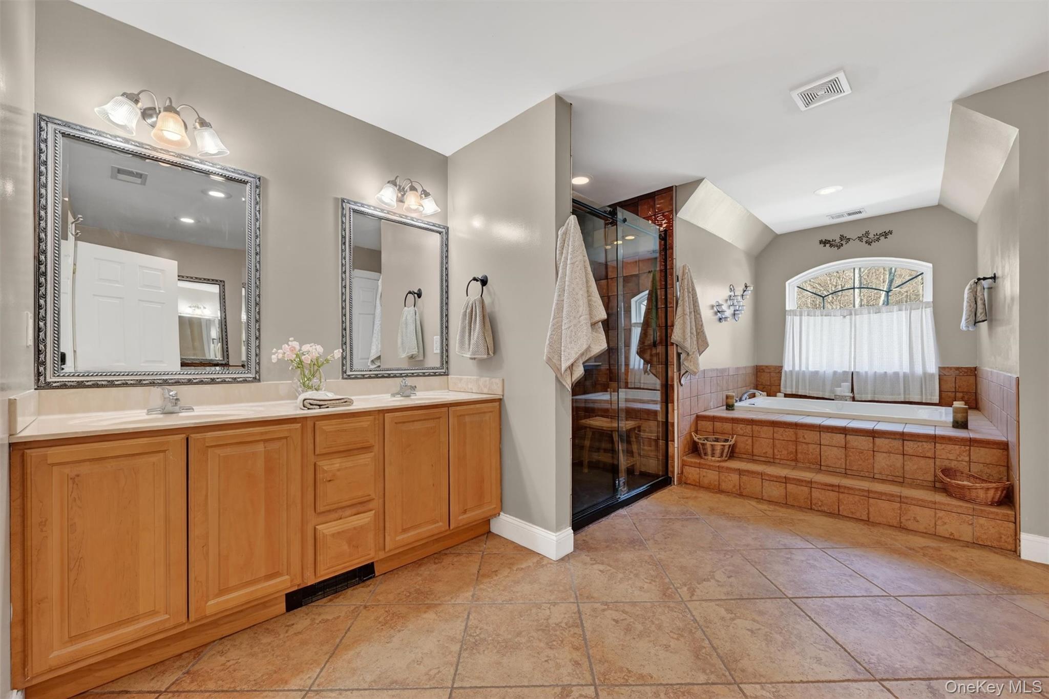 47 Willets Way Newburgh, NY 12550 - Photo 36 of 50 a spacious bathroom with a granite countertop sink a mirror and a bath tub