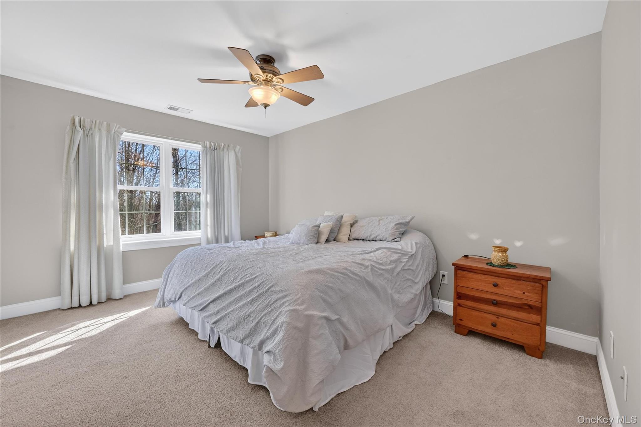 47 Willets Way Newburgh, NY 12550 - Photo 37 of 50 a spacious bedroom with a bed and window