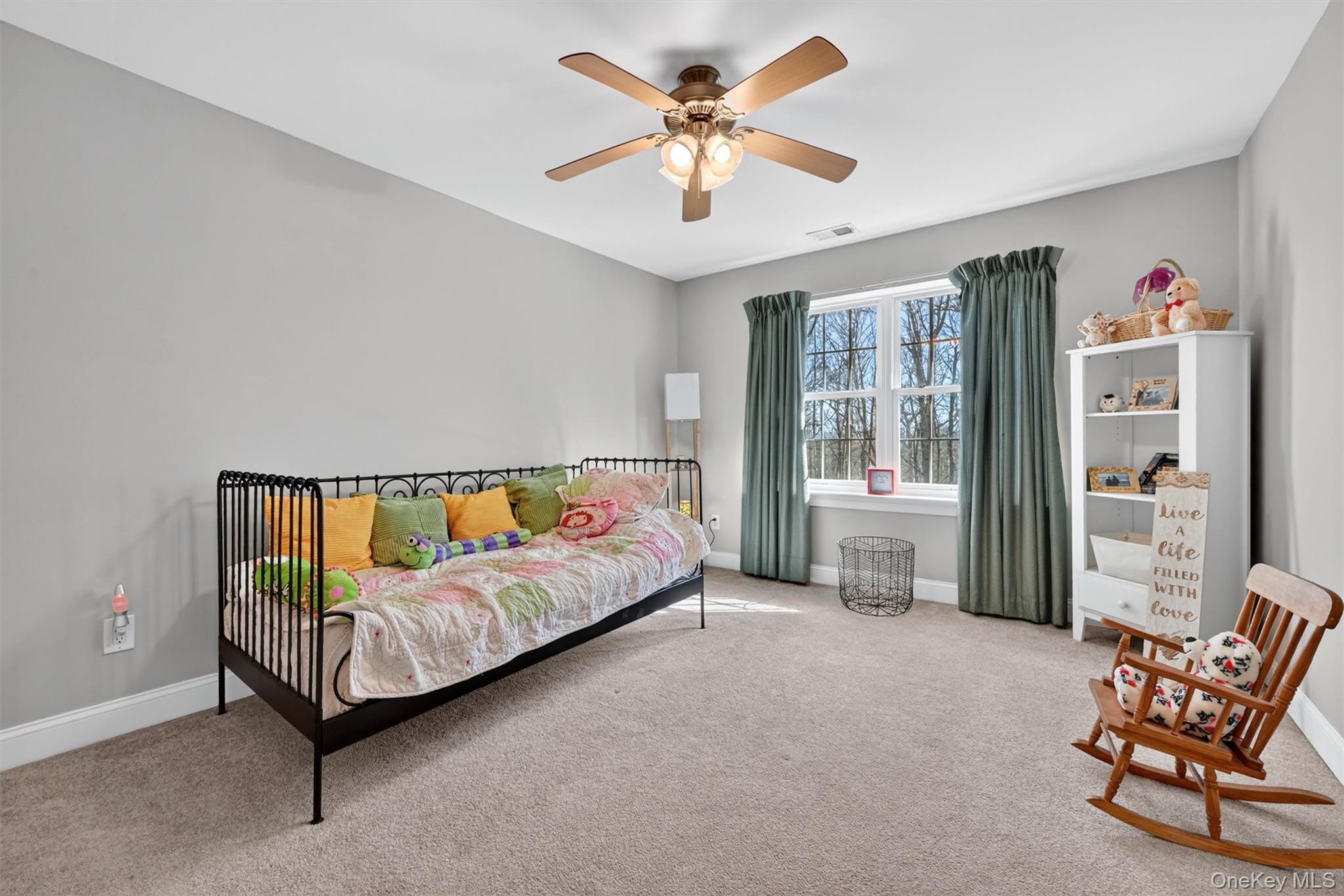 47 Willets Way Newburgh, NY 12550 - Photo 38 of 50 a spacious bedroom with a bed and a couch
