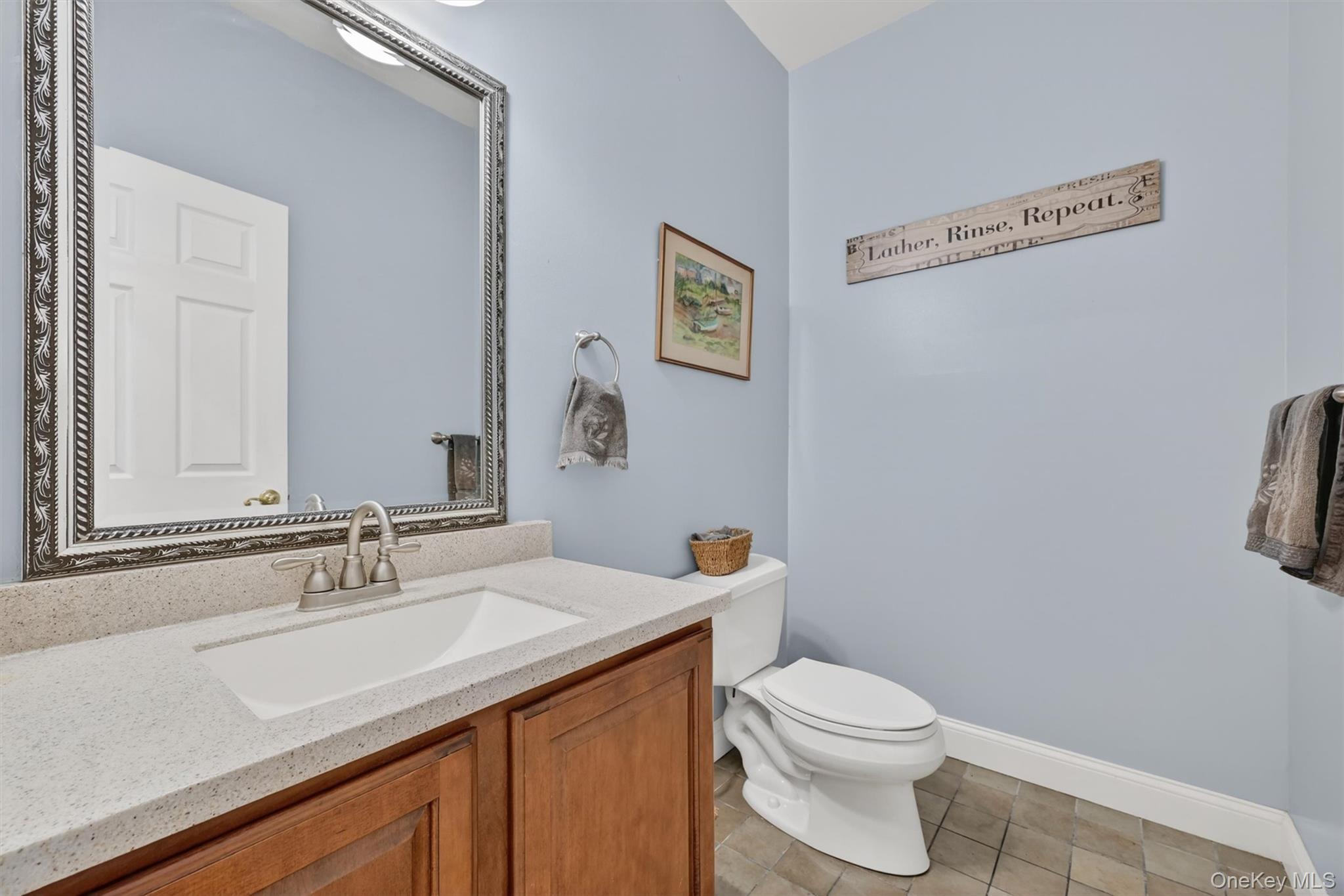 47 Willets Way Newburgh, NY 12550 - Photo 40 of 50 a bathroom with a granite countertop sink a toilet and a mirror